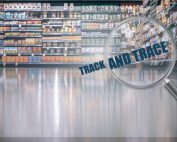 "track and trace" text magnified with magnifying glass in a supermarket